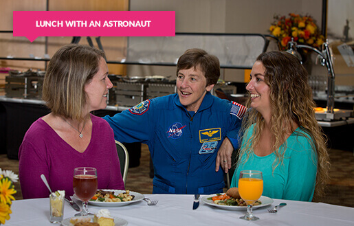 Female astronaut with ladies at lunch